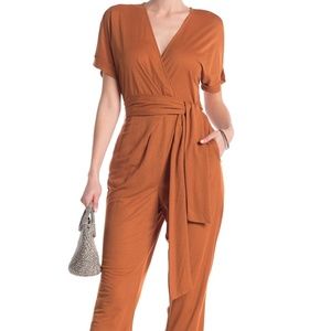 Waist tie jumpsuit with pockets in rust - EUC